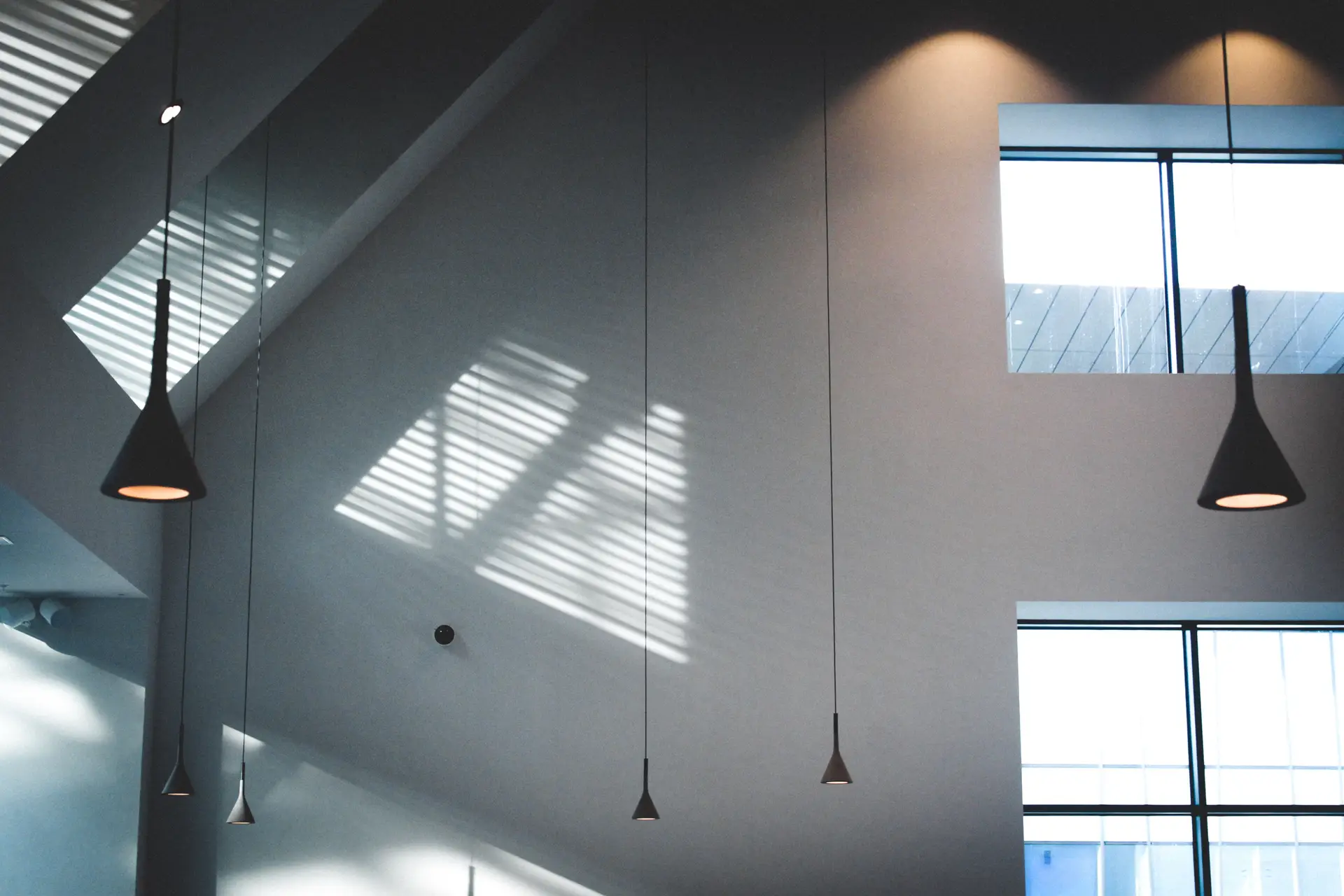 Minimalist architectural wall fixture casting geometric light