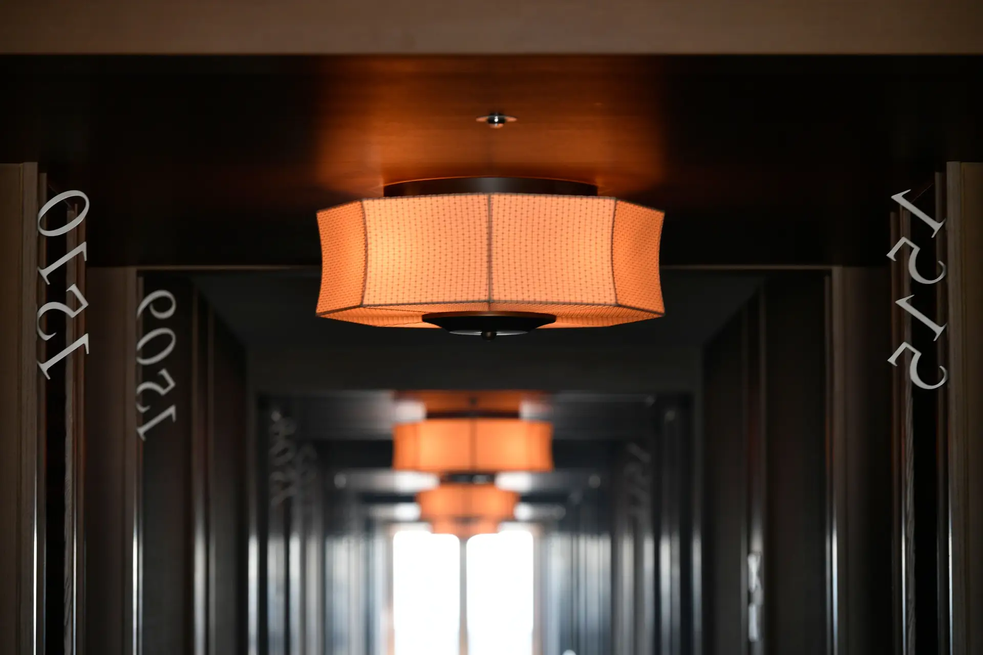 Architectural corridor demonstrating precise recessed lighting and wall grazing