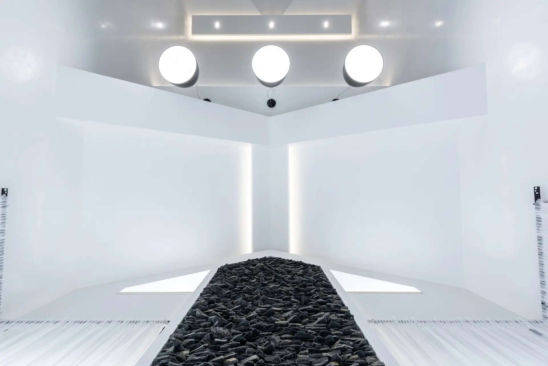 Architectural ceiling composition with warm geometric lighting fixtures
