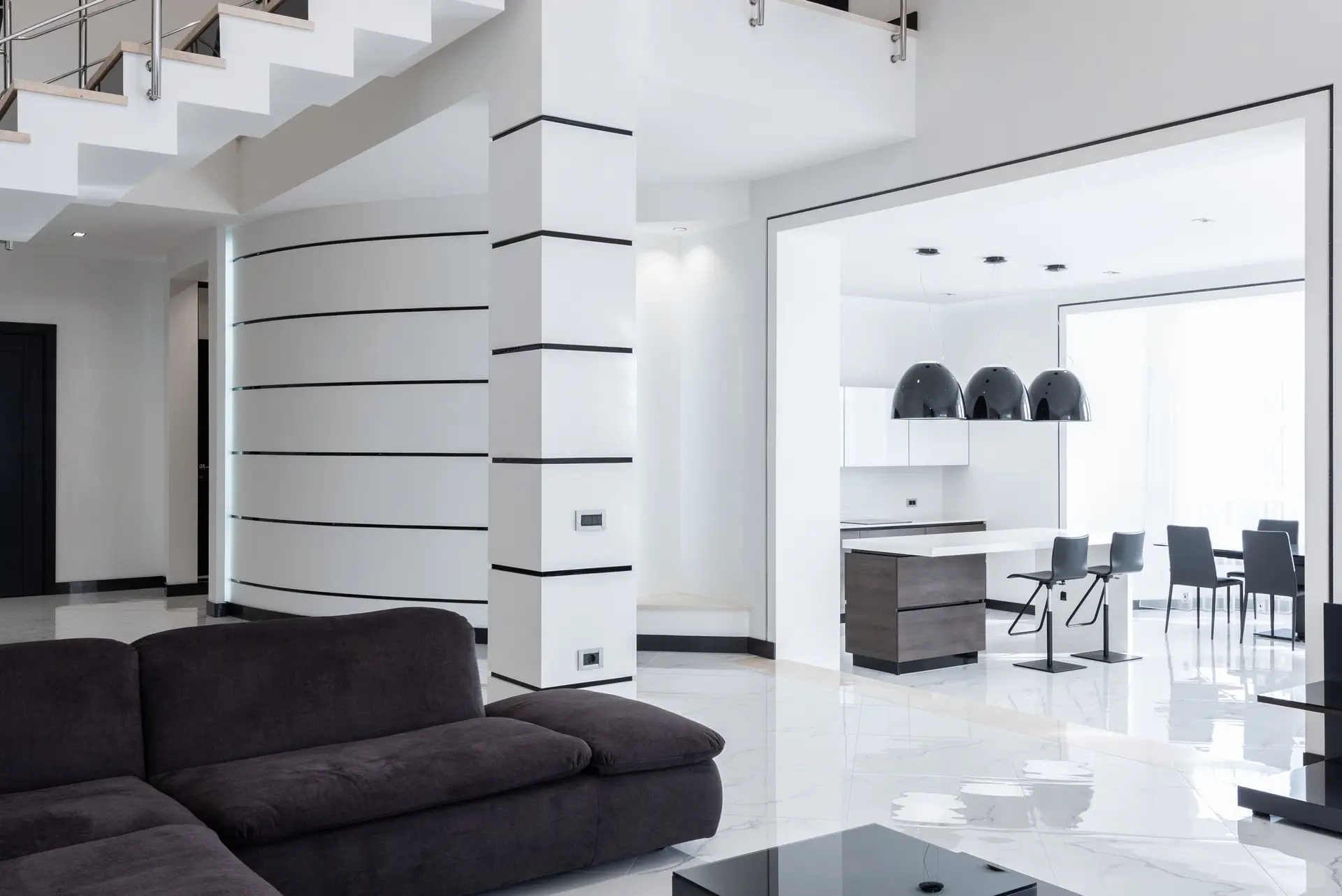 Minimalist architectural residence interior bathed in sculpted ambient light